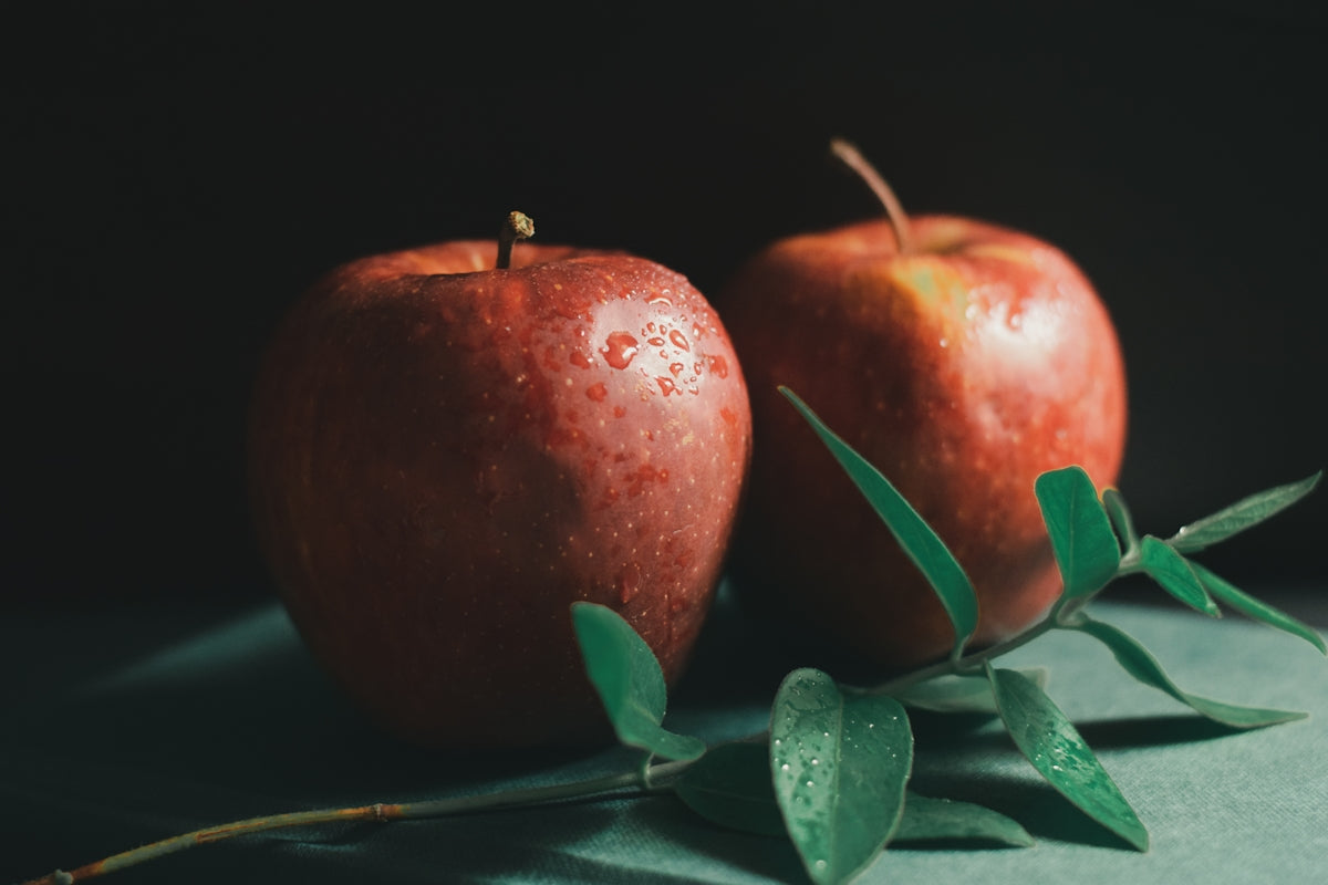 red apple fruit on black surface