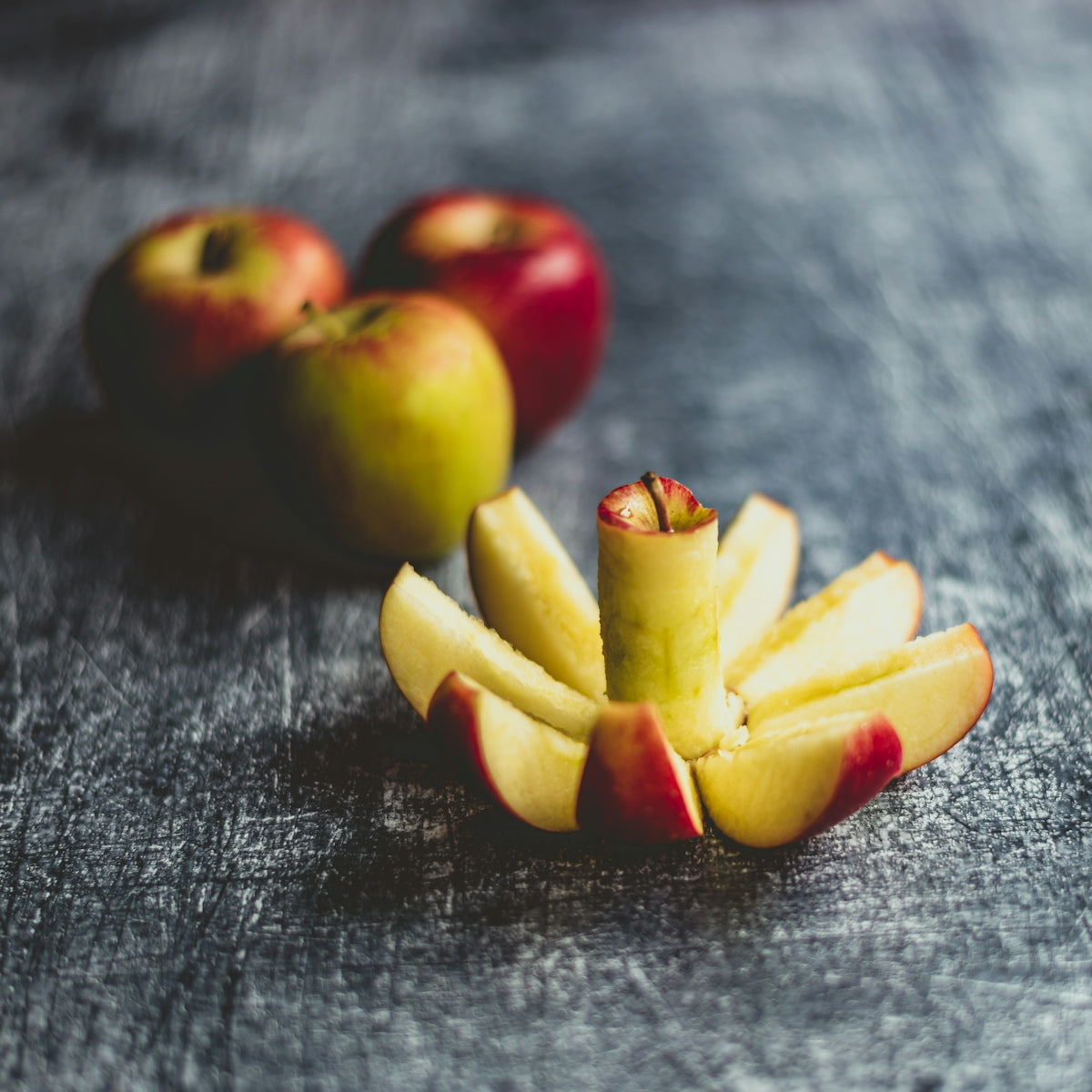 red and green apples on black textile