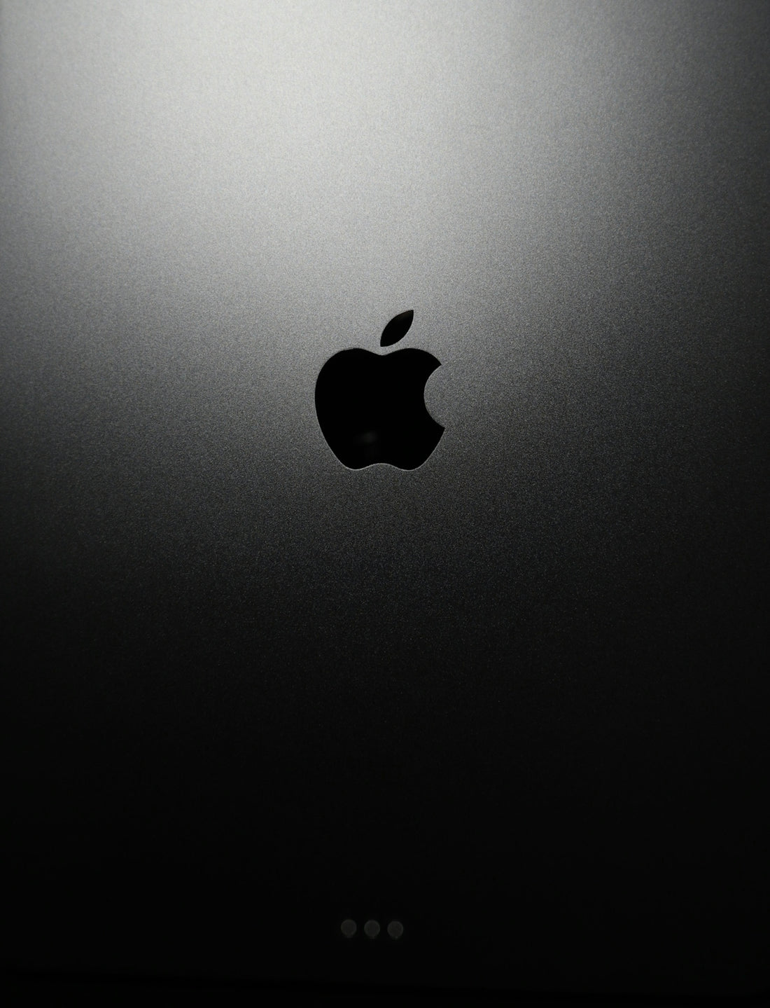 black apple logo on black surface
