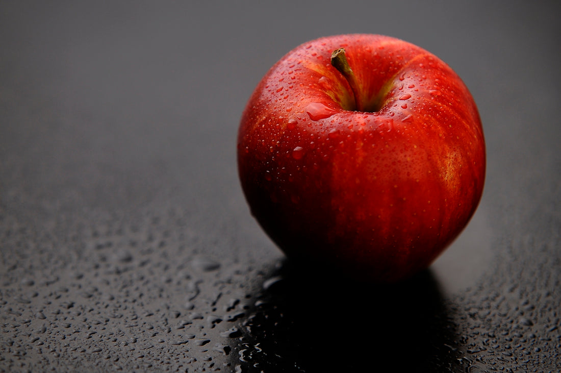 red apple fruit on black surface